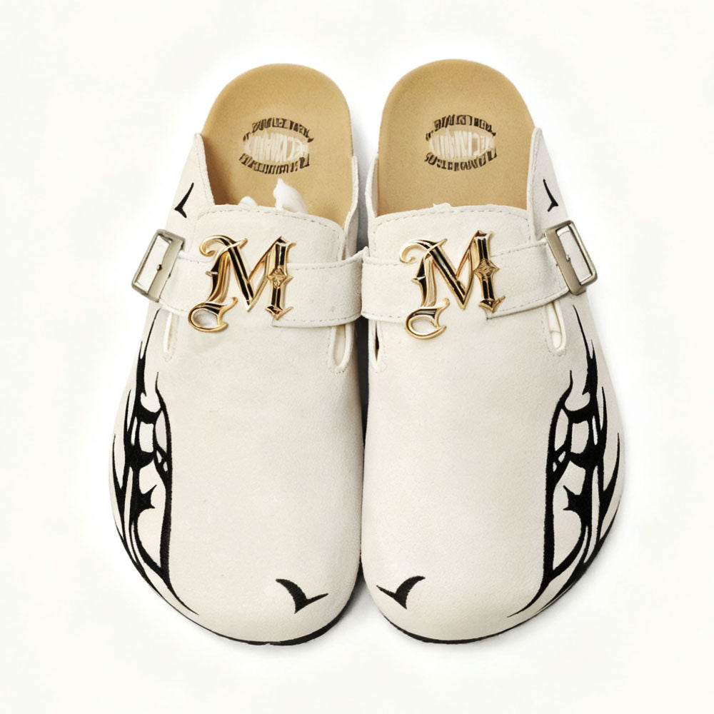 Luxury White Clogs by Meckmanly with Gold "M" Emblem & Black Tribal Tattoo Design - Stylish Slip-On Mules for Fashion-Forward Women